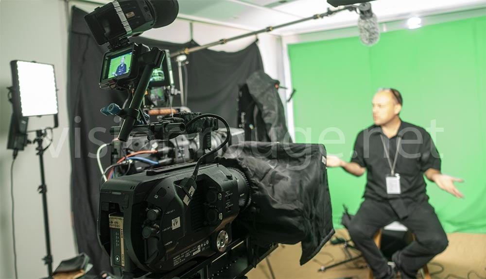 camera operator Filming green screen interview in Hong Kong